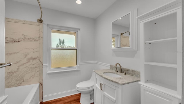 full bathroom featuring vanity, shower / bathing tub combination, hardwood / wood-style flooring, and toilet