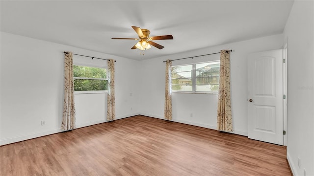 unfurnished room featuring ceiling fan and light hardwood / wood-style flooring