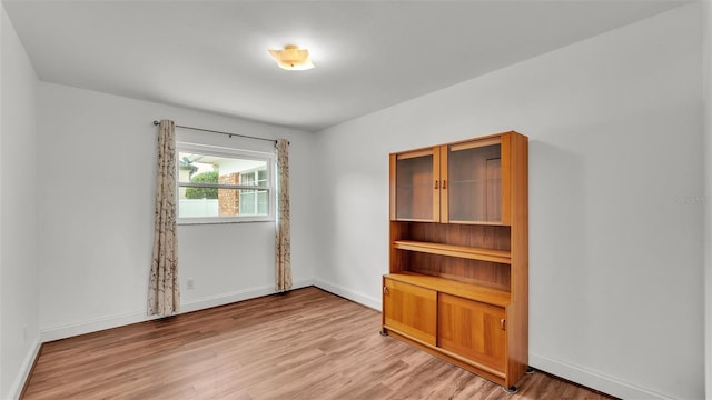 empty room with light wood-type flooring