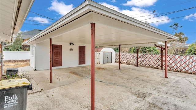 view of patio featuring a storage unit