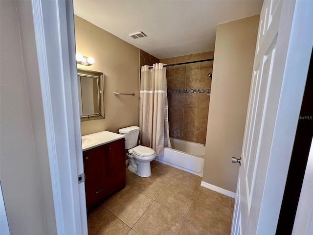 full bathroom with shower / bath combination with curtain, tile patterned floors, vanity, and toilet