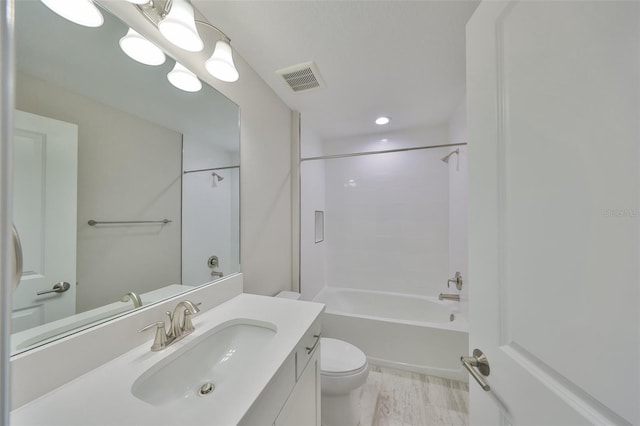 bathroom featuring shower / bath combination, visible vents, vanity, and toilet