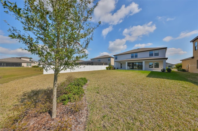 exterior space with a front lawn and fence