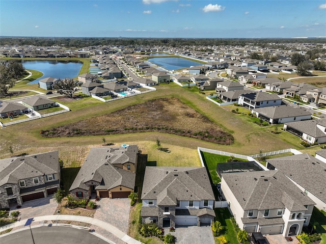 aerial view featuring a residential view and a water view