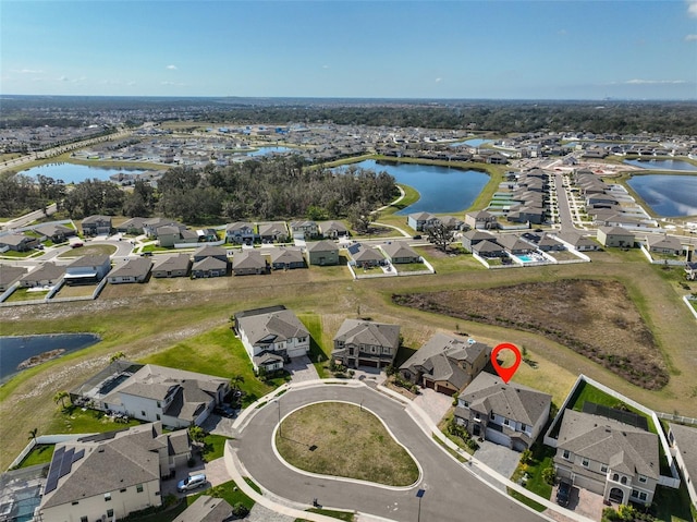 aerial view with a residential view and a water view