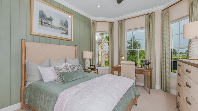 bedroom featuring crown molding and light colored carpet