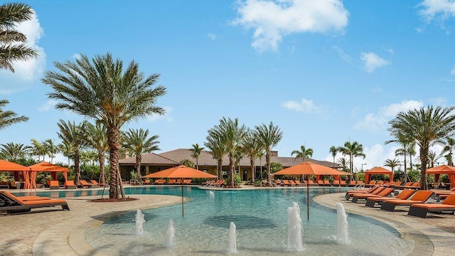 view of pool with a gazebo and pool water feature