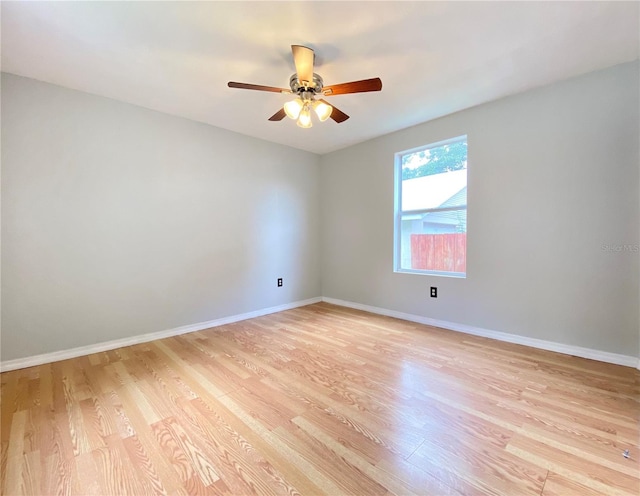 empty room featuring ceiling fan and light hardwood / wood-style flooring