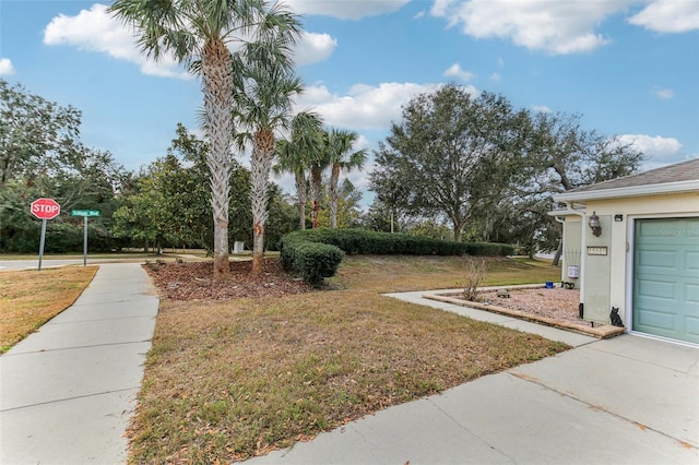 view of yard featuring a garage