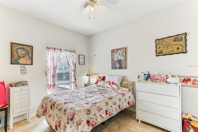 bedroom with ceiling fan and light tile patterned flooring