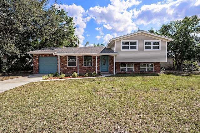 tri-level home featuring a garage and a front lawn