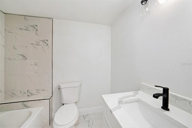 full bathroom featuring marble finish floor, baseboards, a sink, and toilet