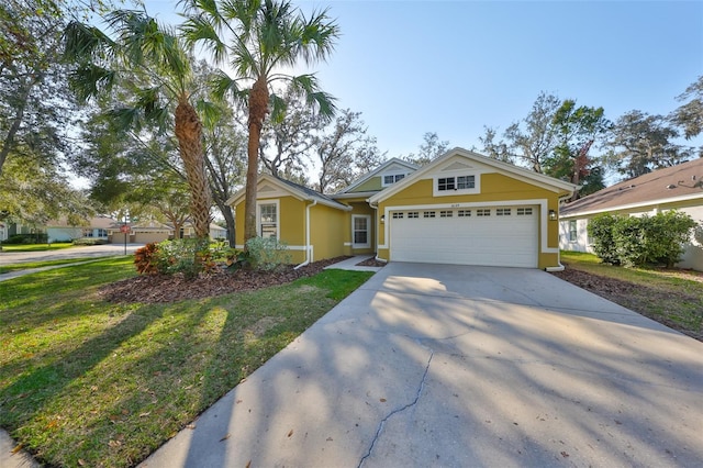 view of front of home with a garage and a front lawn