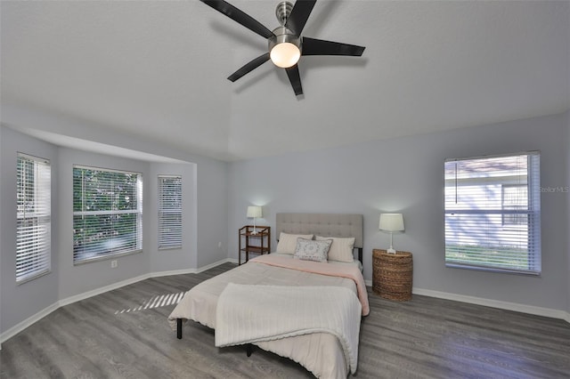 bedroom featuring lofted ceiling, dark hardwood / wood-style floors, and ceiling fan