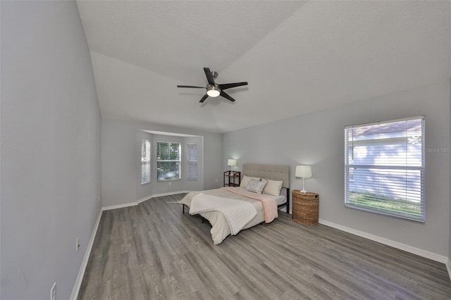 unfurnished bedroom featuring hardwood / wood-style flooring, a textured ceiling, and ceiling fan