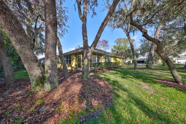 view of yard featuring a sunroom