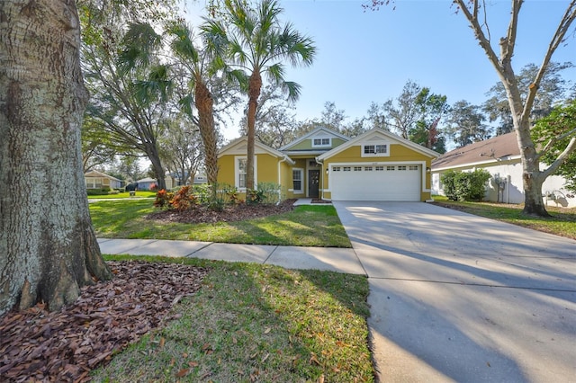 view of front of home with a garage and a front lawn