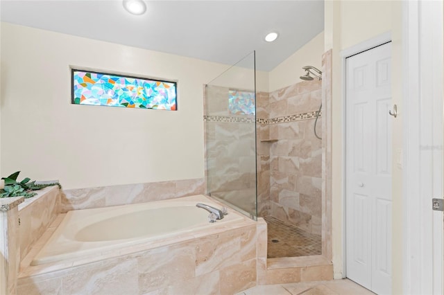 bathroom featuring tile patterned floors and plus walk in shower