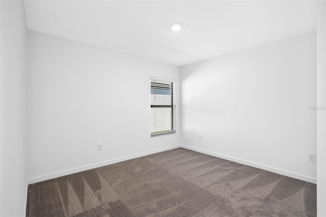 unfurnished room featuring carpet floors