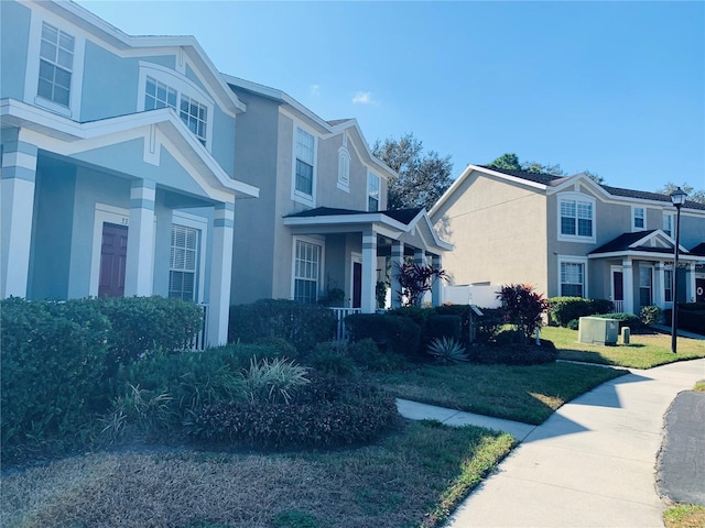 view of side of property with a lawn