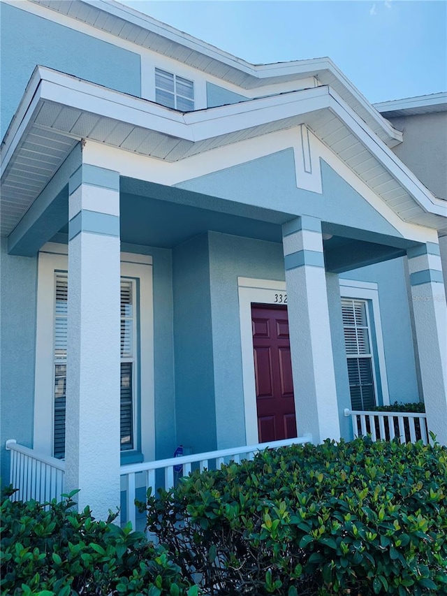 entrance to property featuring covered porch