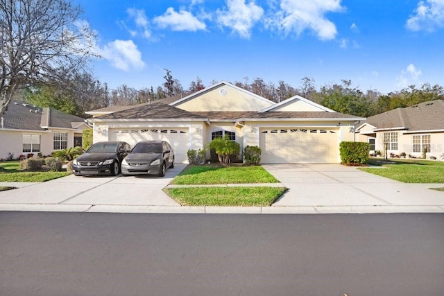 single story home with a garage and a front yard