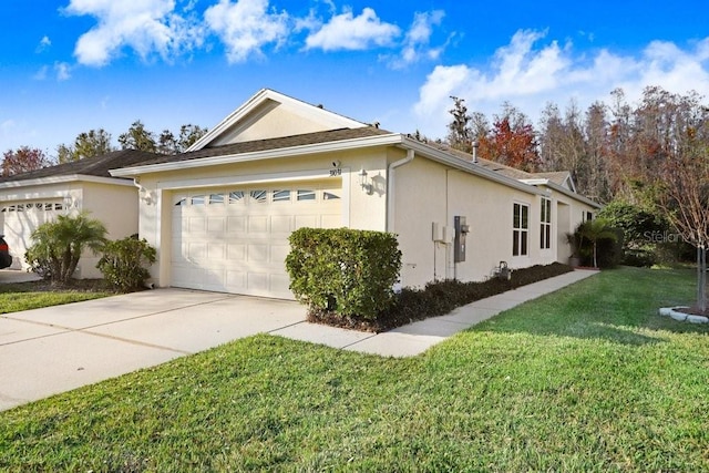 view of home's exterior with a yard and a garage