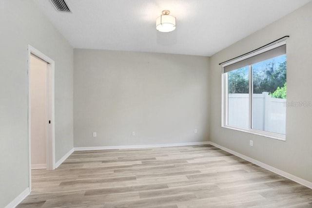 unfurnished room featuring light hardwood / wood-style flooring