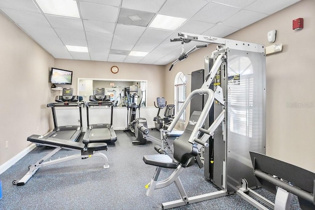 workout area featuring a paneled ceiling