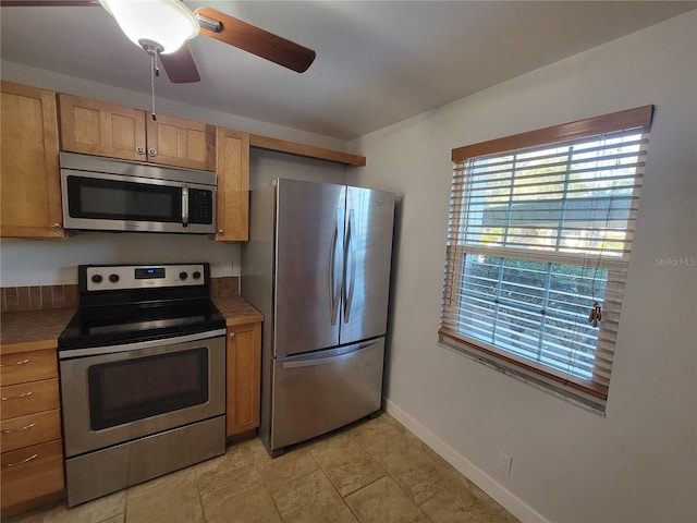 kitchen featuring stainless steel appliances and ceiling fan