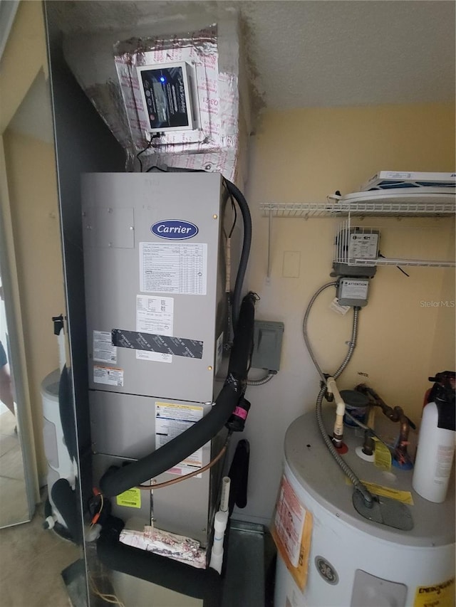 utility room featuring water heater