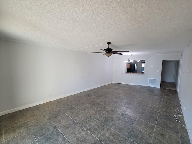 unfurnished living room featuring ceiling fan with notable chandelier and a textured ceiling