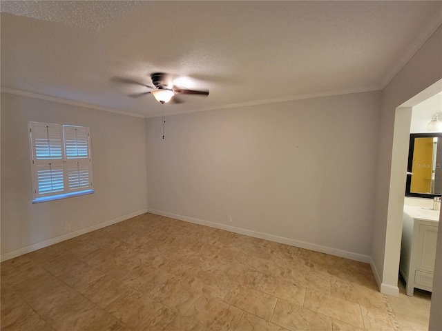 spare room featuring ornamental molding, ceiling fan, and a textured ceiling