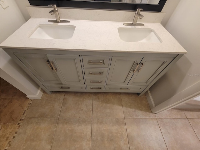 bathroom with tile patterned floors and vanity