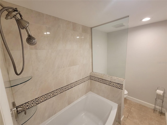 bathroom with toilet and tile patterned flooring