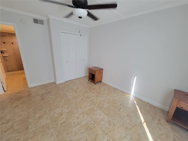 unfurnished bedroom featuring ornamental molding, ceiling fan, and a closet