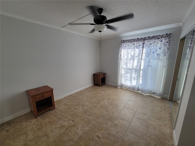 unfurnished room with ceiling fan, crown molding, and a textured ceiling