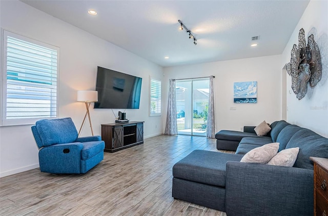 811 Winterside Dr, Apollo Beach, FL 33572 - living area with light wood-style flooring, recessed lighting, and track lighting