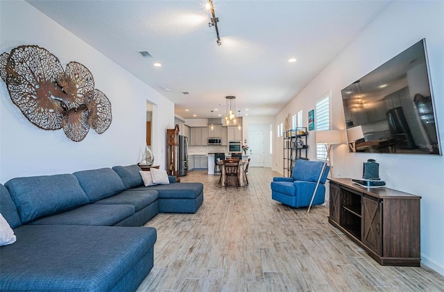 811 Winterside Dr, Apollo Beach, FL 33572 - living room featuring light wood finished floors and recessed lighting