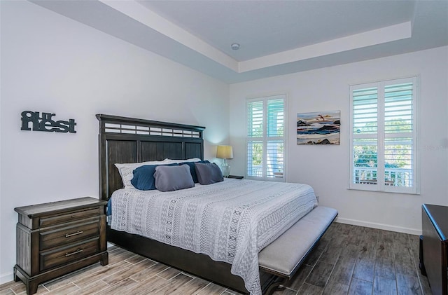 811 Winterside Dr, Apollo Beach, FL 33572 - bedroom featuring wood finished floors and a raised ceiling