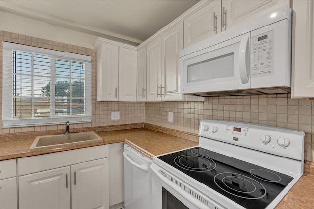 kitchen with white cabinetry, sink, backsplash, and white appliances