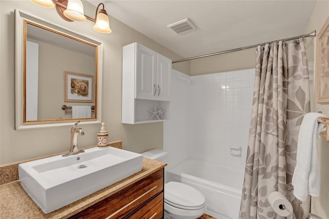 full bathroom featuring toilet, vanity, and shower / bath combo with shower curtain