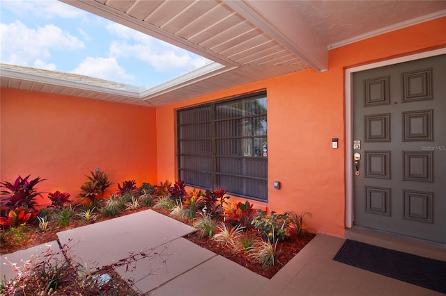 property entrance featuring a patio area