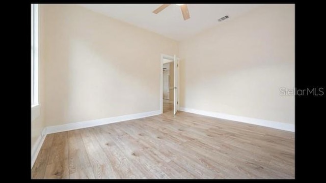 empty room featuring ceiling fan and light hardwood / wood-style flooring