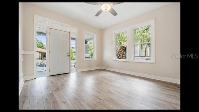 foyer featuring light hardwood / wood-style flooring and ceiling fan