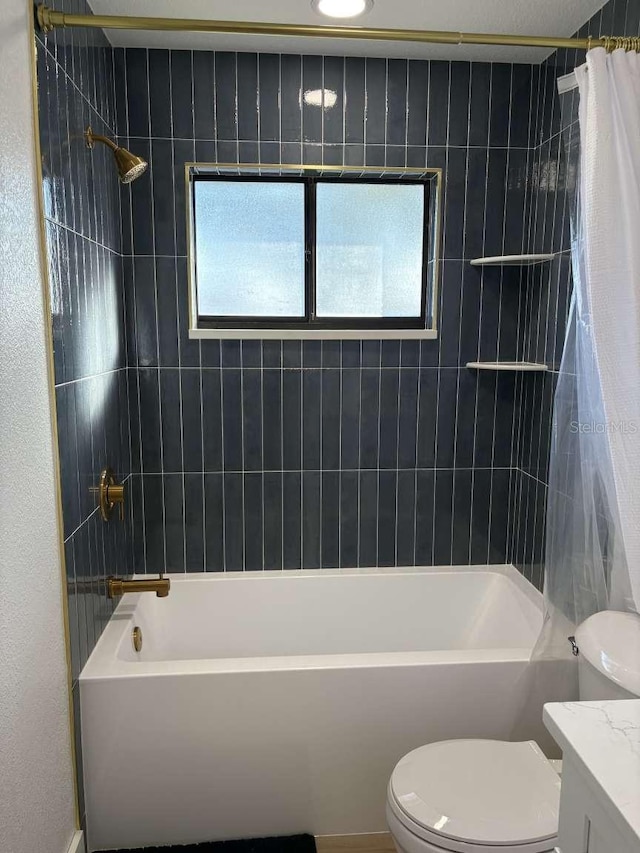 full bathroom featuring vanity, toilet, and shower / bath combo with shower curtain