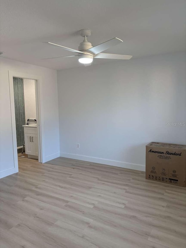 unfurnished room featuring ceiling fan and light hardwood / wood-style flooring