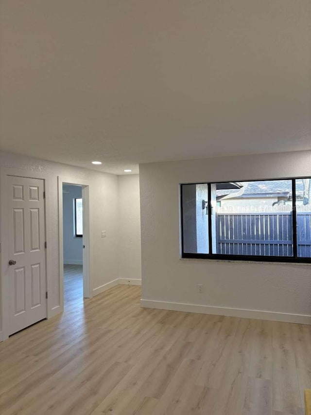 spare room featuring light wood-type flooring