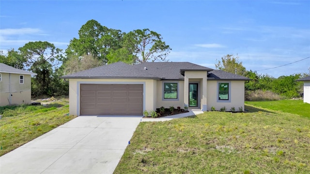 view of front of house with a garage and a front lawn