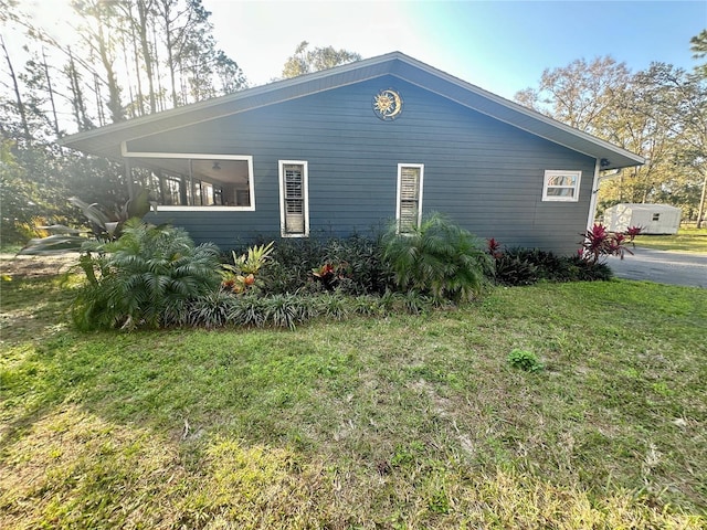 view of property exterior featuring a yard